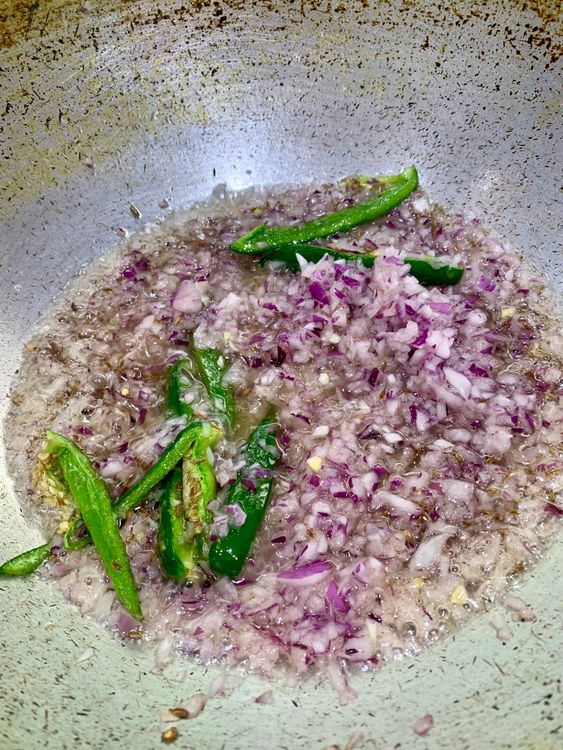 Step 4.1: Add the finely chopped onions, cooking until they soften and turn a light pink
