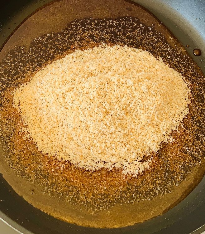 Step 1.1: Add the roasted coconut mixture to the pan