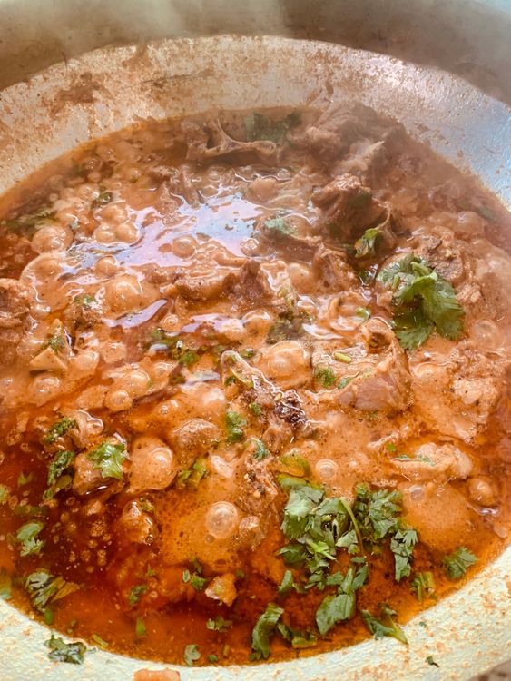 Step 4.1: Stir in kewra water and garnish with fresh coriander