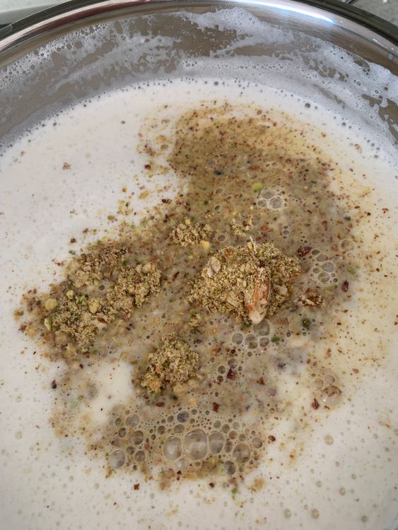 Step 1.3: Add sugar, cardamom powder, rock salt and powdered nuts to the pan