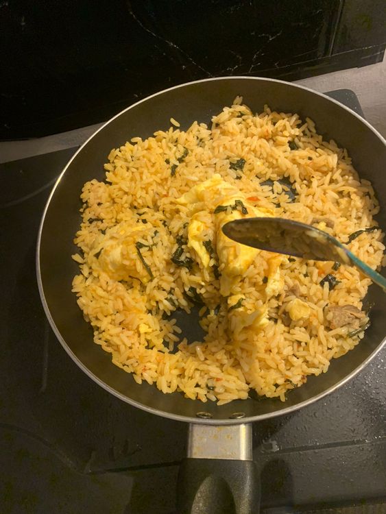 Step 1.1: Add the chopped spring onions and pumpkin leaves