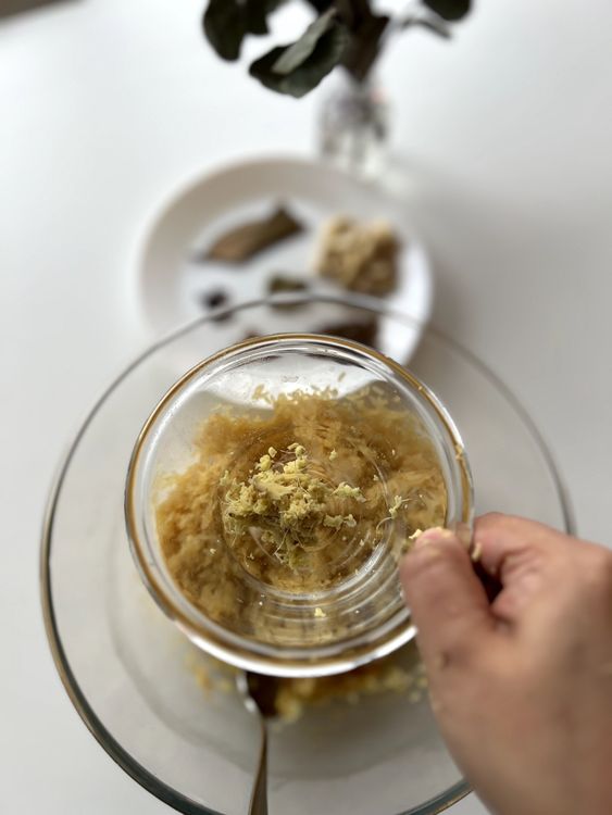 Step 1.1: Grate ginger and squeeze out the juice, keeping the ginger fiber and juice aside
