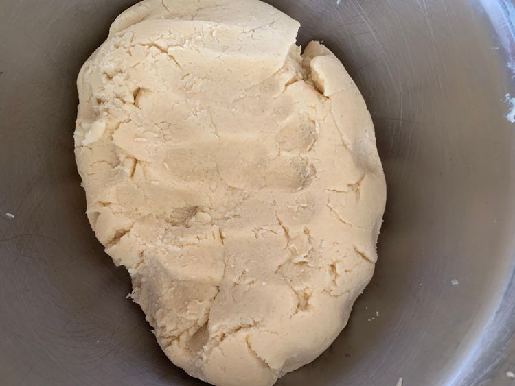 Step 1.3: Gradually add the sifted flour and salt to the butter mixture