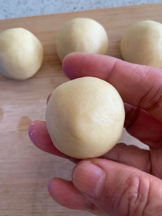 Step 2.1: Roll small portions of dough, about 1 tablespoon, into smooth balls