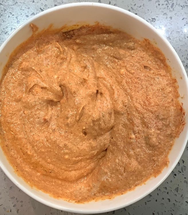 Step 1.2: In a mixing bowl, combine a tbsp of ginger garlic paste, kashmiri red chilli powder, amchur, chaat masala, ground black peppercorns, cumin powder, coriander powder, salt, and 2 tbsp of mustard oil with the yogurt
