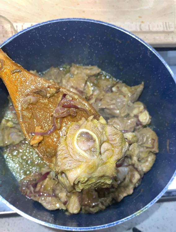 Step 1.2: Add the mutton pieces to the wok and let them cook over medium-high heat for a few minutes, stirring occasionally, until they change colour and the oil starts leaving the sides