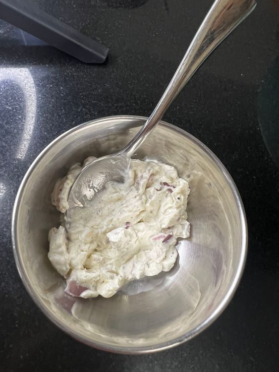 Step 1.1: Take hung curd in a bowl and add salt, pepper and chopped onion into it to make burger cheese cream
