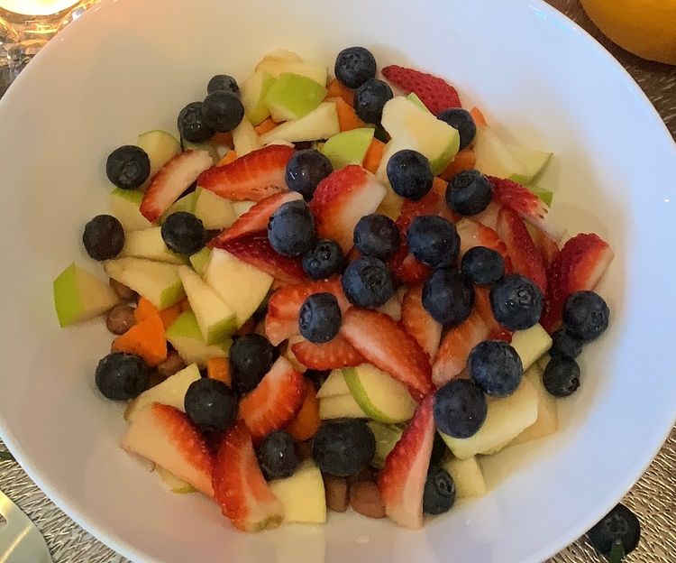 Step 1.1: Combine the boiled peanuts, diced cucumber, carrots, and chopped fruits in a wide bowl
