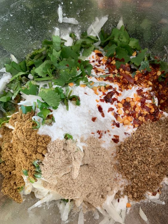 Step 1.1: In a mixing bowl, combine the grated potatoes, sama flour, sendha namak, red chilli flakes, green chillies, ginger (if using), amchur, cumin powder and coriander powder