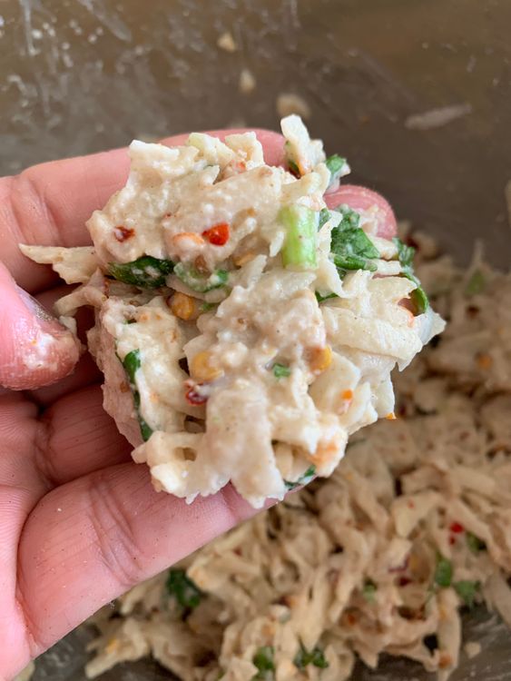 Step 1.1: Take small portions of the potato mixture, flatten them slightly with your fingers, and then place them in the hot oil