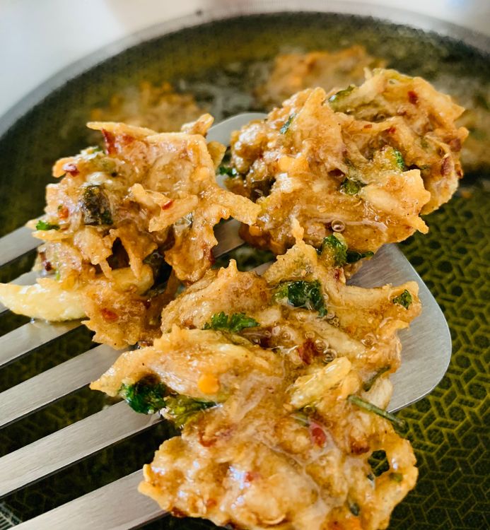 Step 1.1: Use a slotted spoon to transfer the fritters to a kitchen towel to drain excess oil