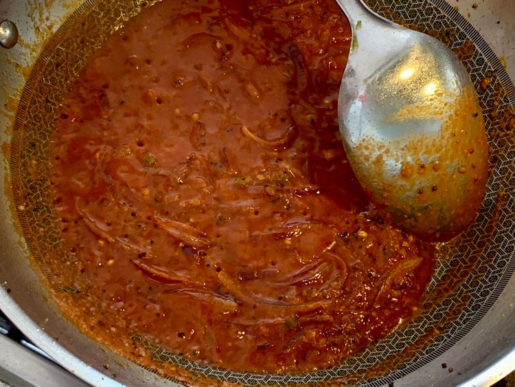 Step 1.1: Pour in the ground or pureed tomato, and stir and cook for 2-3 minutes or until oil oozes on the surface