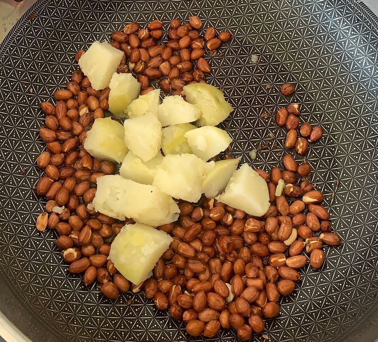 Step 3.1: Add the boiled potato cubes and cook until the edges turn golden