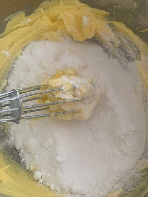 Step 2.1: In a mixing bowl, whisk the softened butter and powdered sugar until the mixture is light and creamy