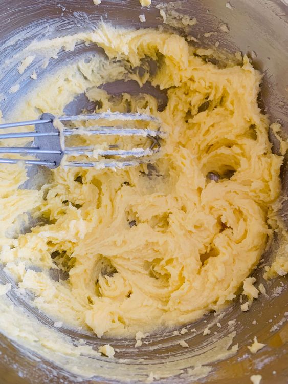Step 2.2: In a mixing bowl, whisk the softened butter and powdered sugar until the mixture is light and creamy