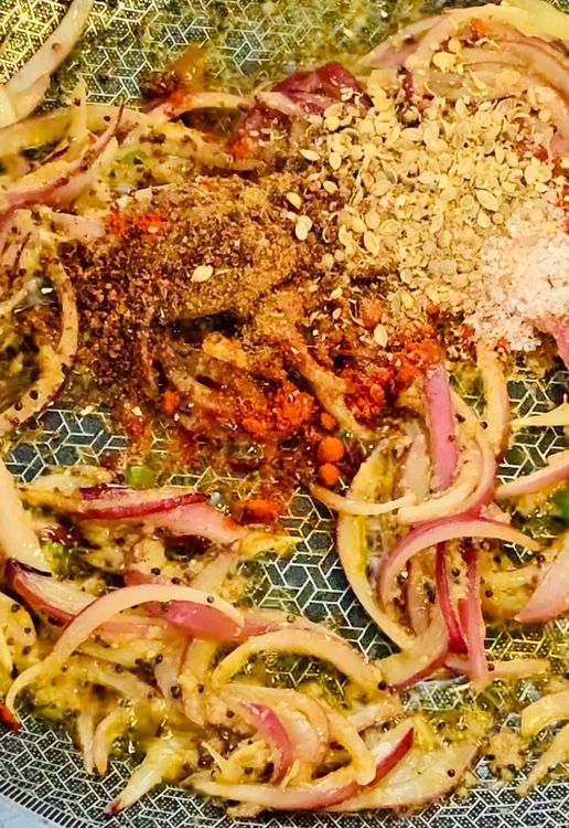 Step 1.1: Add cumin powder, coriander powder, salt, dry pomegranate powder (anardana), kashmiri or degi mirch and sprinkle some water