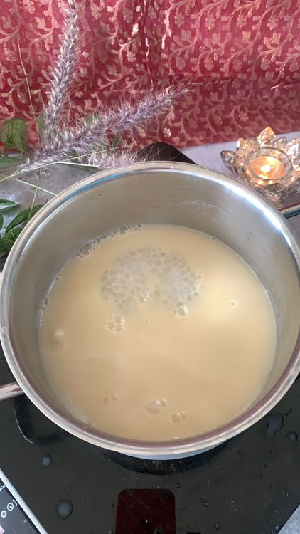 Step 1.1: Add the translucent sabudana and the sliced coconut to the simmering milk