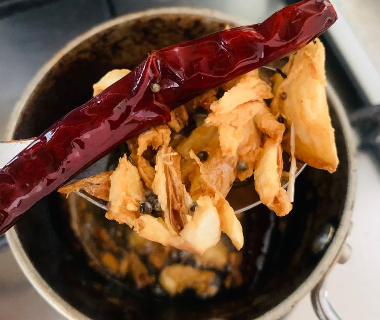 Step 3.1: Add the dry red chilli, achari masala, curry leaves (if using), and sauté for 30 seconds to release the aromas