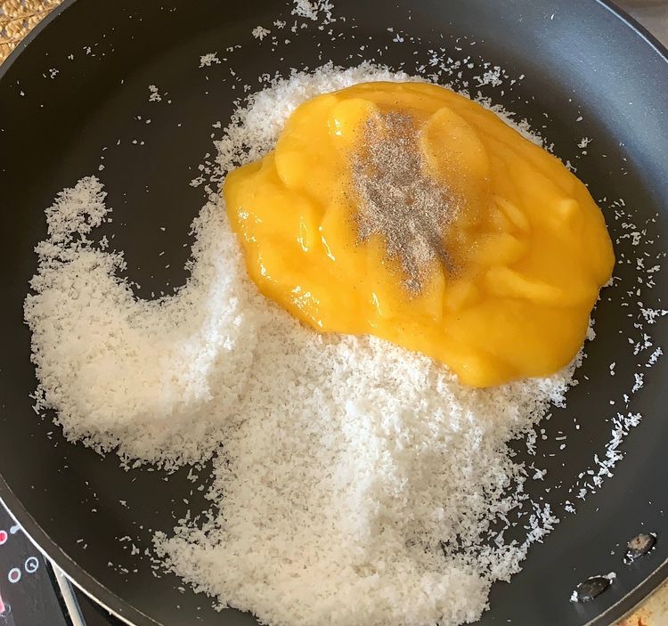 Step 1.2: Add the mango puree, and cardamom powder and stir them for a minute