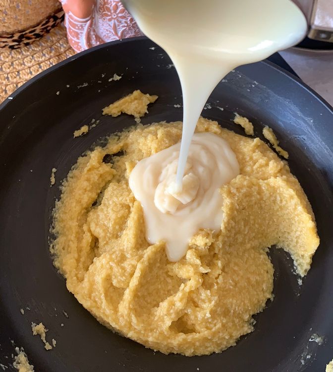 Step 1.1: Pour the condensed milk into the pan, stir and cook the mixture over low-medium heat, stirring continuously until the mixture thickens to a dough-like consistency