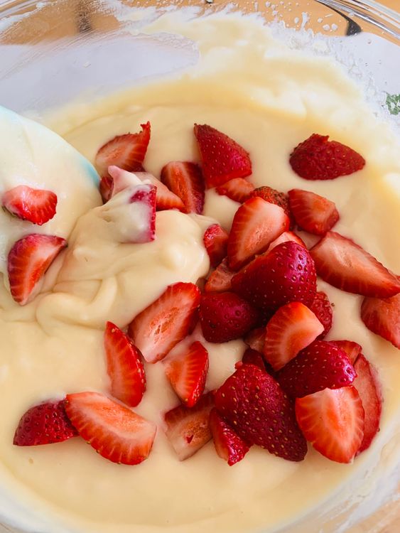 Step 5.1: Gently fold in the diced strawberries, ensuring they are evenly distributed throughout the batter