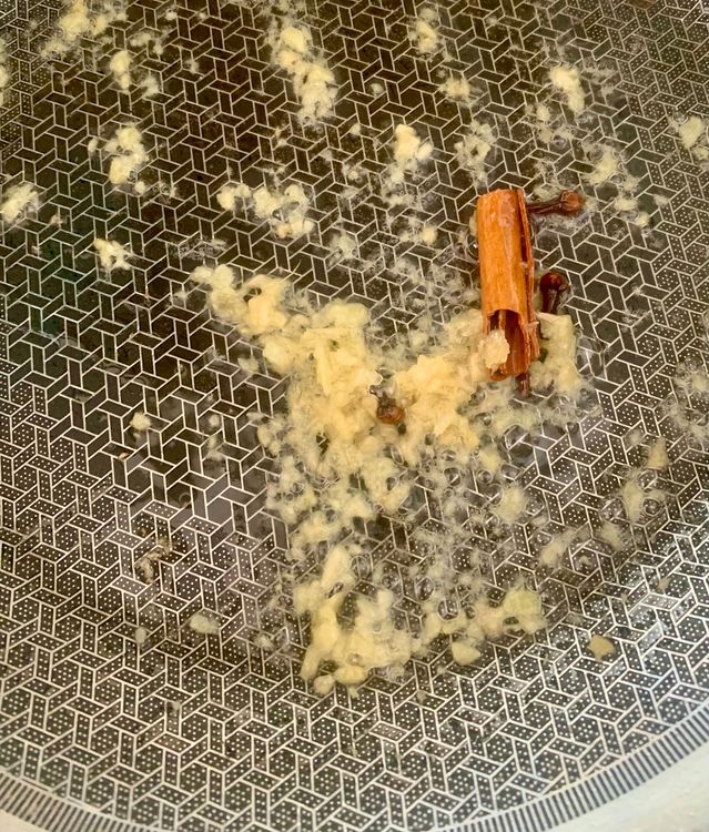 Step 2.1: Add finely chopped ginger, cinnamon stick, and cloves