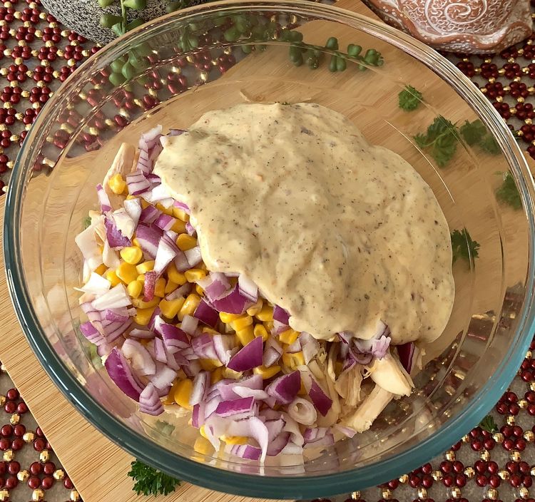 Step 1.1: Pour the dressing over the chicken mixture and toss gently to coat all the ingredients evenly