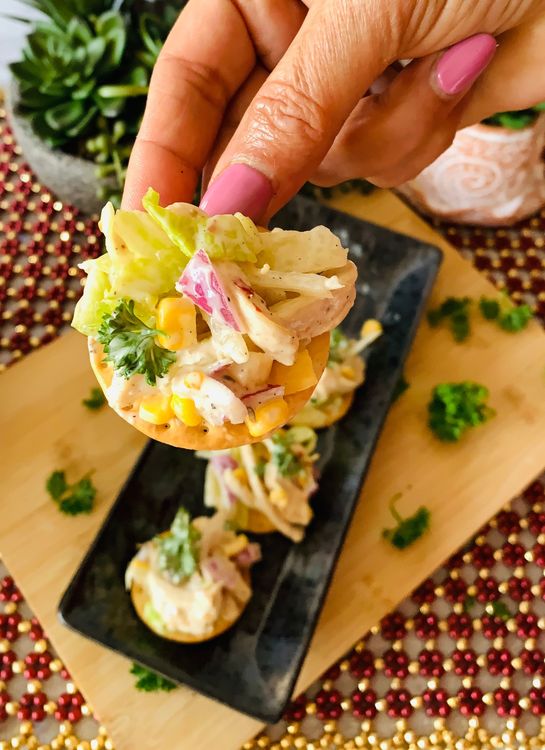 Step 1.1: Place a small portion of the chicken mixture as a topping on each cracker and serve chilled
