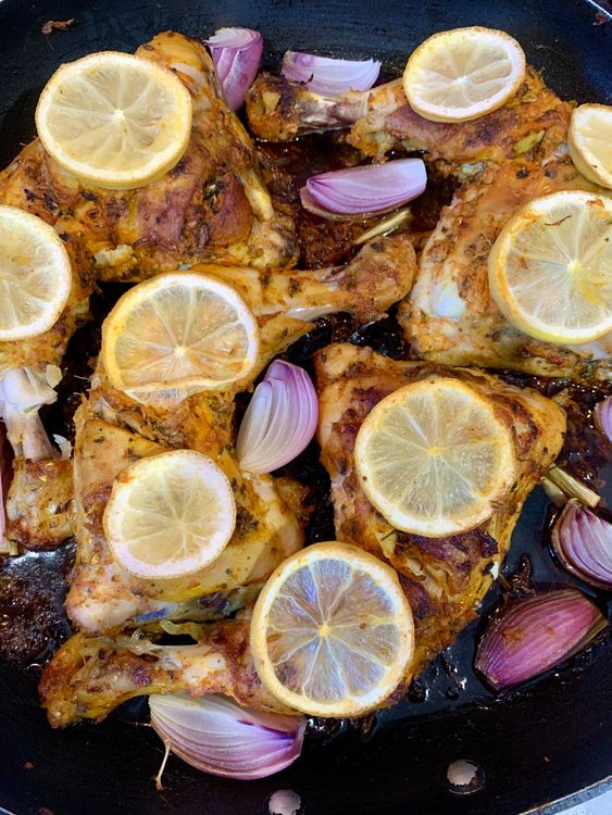 Step 1.2: Place the chicken Marylands in the skillet, skin-side down, along with lemon slices