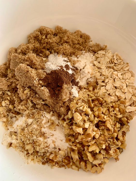 Step 1.1: In a mixing bowl, combine rolled oats, all-purpose flour, brown sugar, baking powder, cinnamon powder, salt, and chopped walnuts
