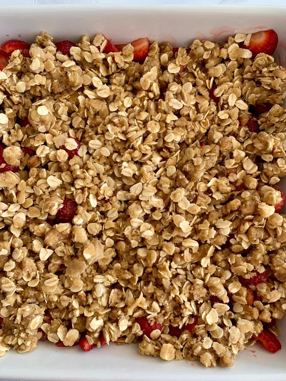 Step 3.1: Sprinkle the crumble topping evenly over the strawberries