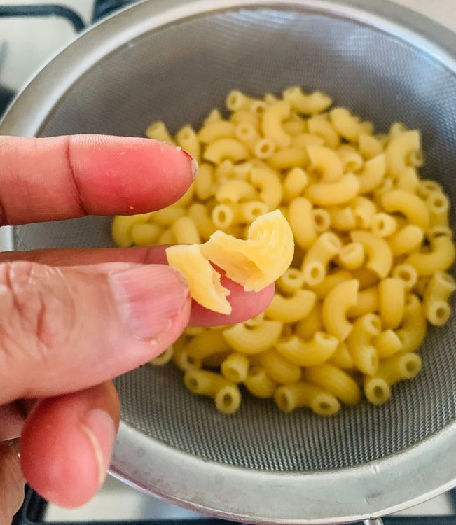 Step 2.1: Cook the macaroni until it's 90% done (al dente), about 6–8 minutes