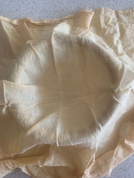Step 1.2: Take a fine mesh strainer, place it over a deep bowl and cover it with a muslin/cheesecloth
