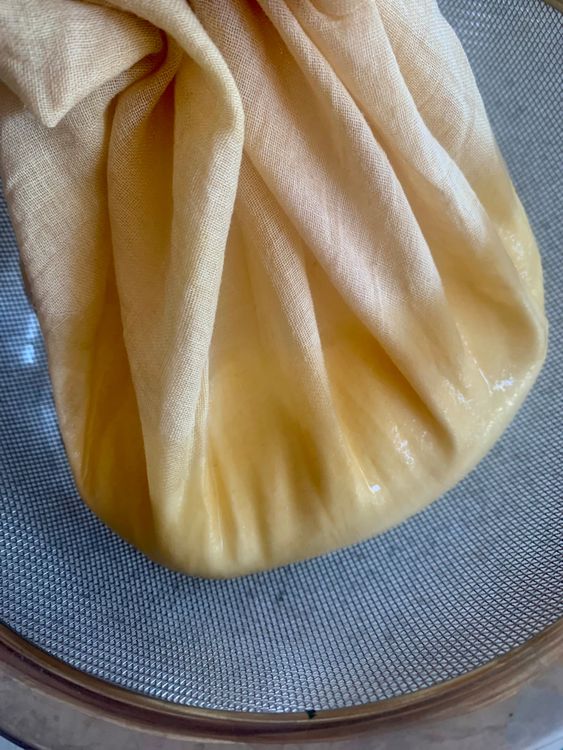 Step 1.1: Gather the edges of the cloth or use a string to tie it, creating a pouch with the yogurt inside
