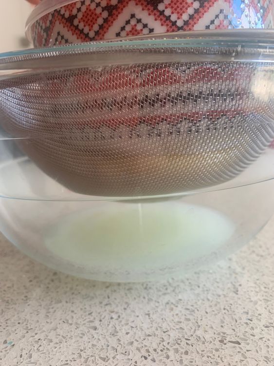 Step 1.2: Hang this pouch over the bowl (to collect the whey) or place it in the strainer with a weight on top for at least 4-6 hours, or overnight