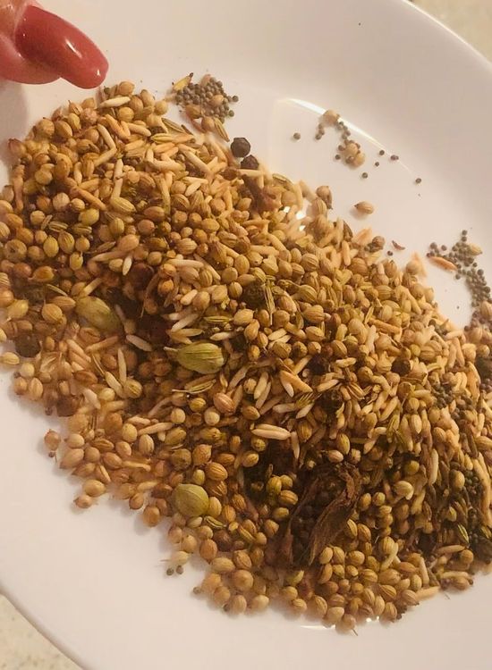 Step 1.2: Add black mustard, coriander, cumin, peppercorns, cardamoms, cloves, and fennel seeds and dry roast them until they release their aroma and turn lightly golden