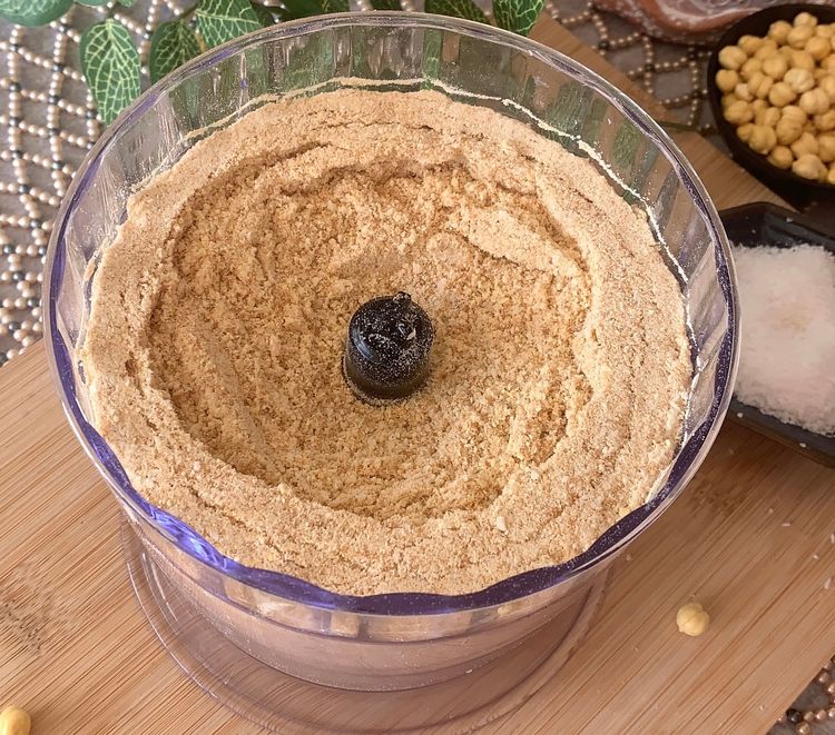 Step 1.1: Add jaggery powder, cardamom powder, cinnamon powder, and desiccated coconut into the food processor and blend until they form a fine mixture