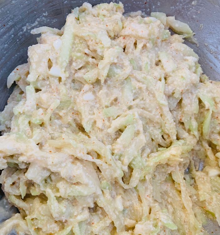 Step 1.1: Add gram flour, semolina, salt, red chilli powder, coriander powder, and cumin powder to the bowl