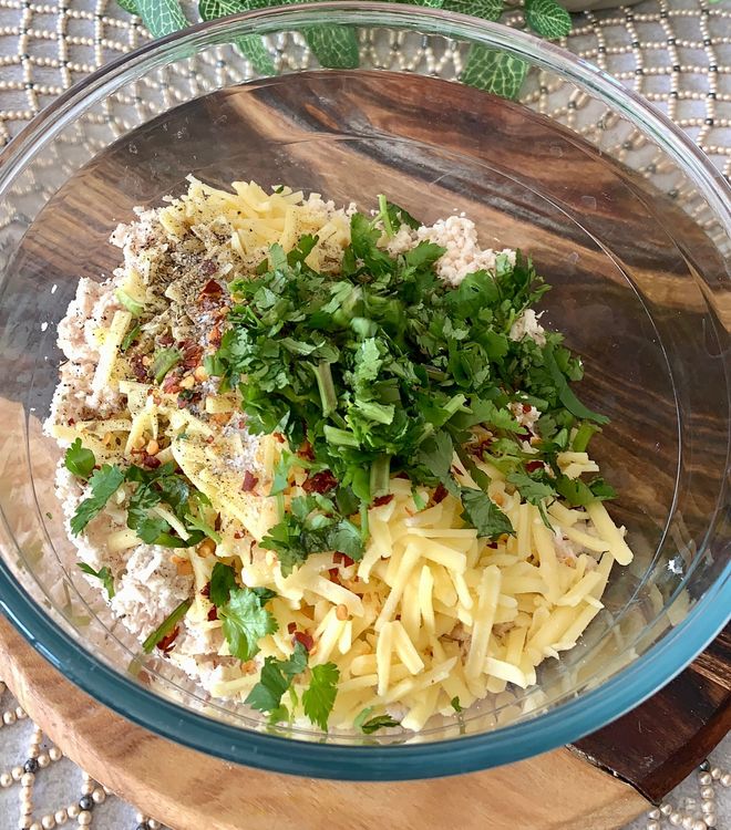 Step 1.1: In a large mixing bowl, combine the ground chicken, grated cheese, garlic paste, oregano, red chilli flakes, black pepper powder, salt, and chopped coriander leaves