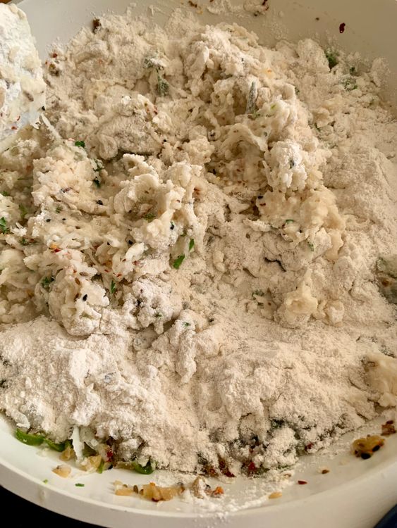 Step 1.1: Reduce the heat and gradually add rice flour, stirring continuously to form a soft dough-like mixture