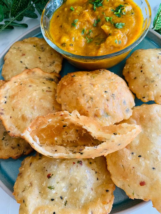 Step 2.1: Serve hot Murauri Poori with potato curry, channa curry, chutney, yogurt, or pickle for a flavorful meal