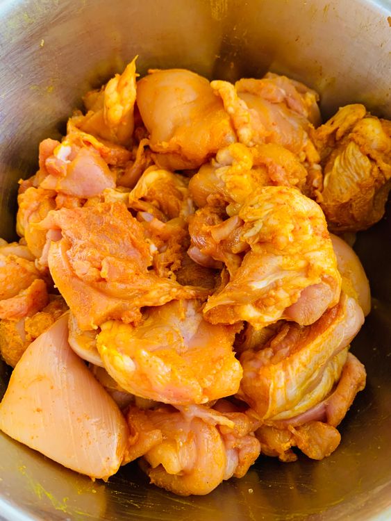 Step 1.1: Mix the chicken with lemon juice, red chilli powder, turmeric, and salt in a large bowl