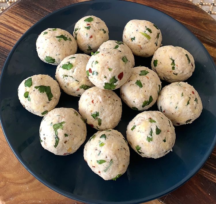 Step 1.2: Take small portions of the chicken and cheese mixture and shape them into lemon-sized balls