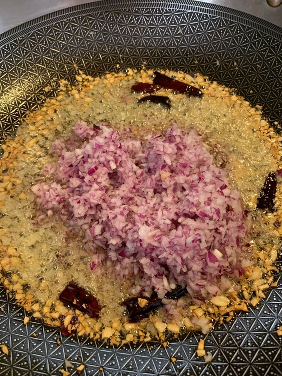 Step 3.1: Add chopped onions and cook until they turn translucent