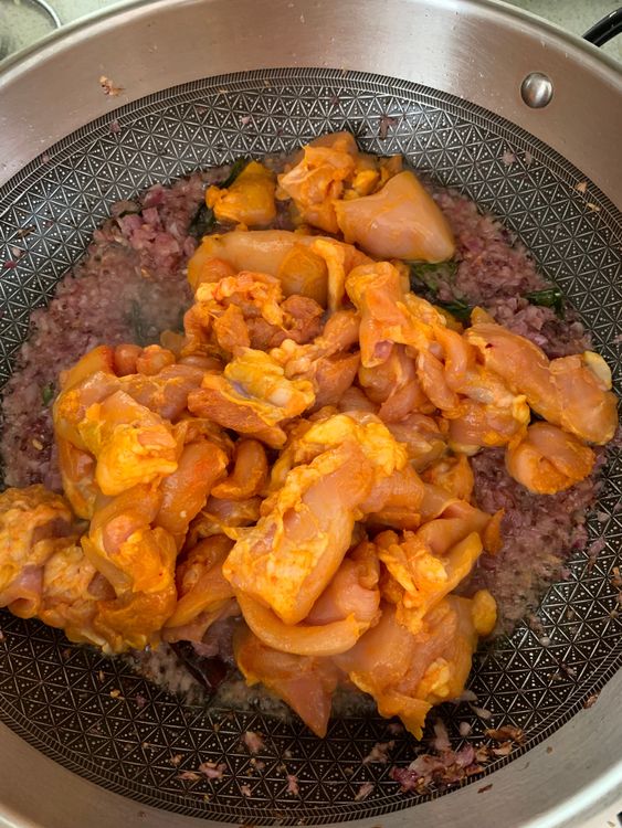 Step 3.1: Add the marinated chicken and cook on medium-high heat until it changes colour and oil separates