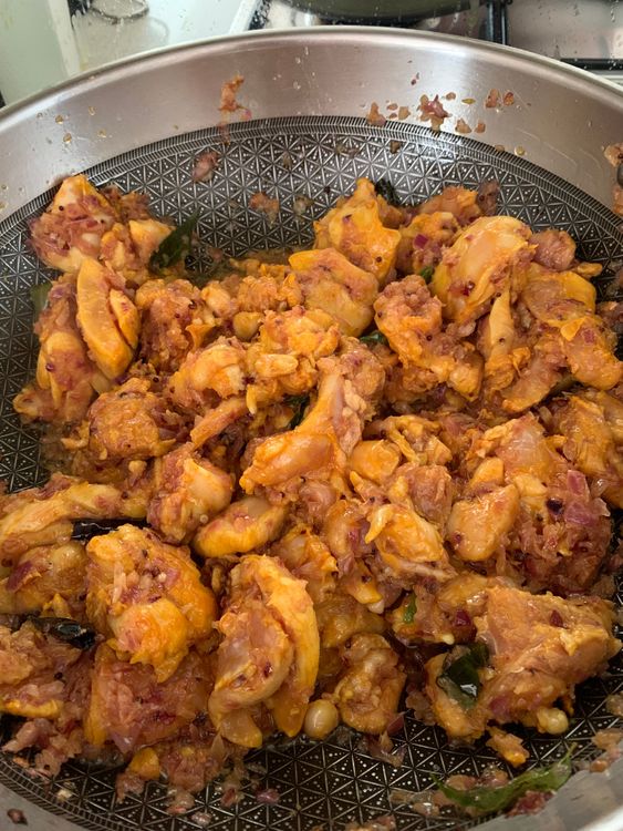 Step 3.2: Add the marinated chicken and cook on medium-high heat until it changes colour and oil separates