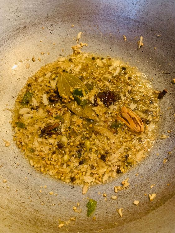 Step 2.1: Add the ginger-garlic-chilli paste and sauté until golden and fragrant