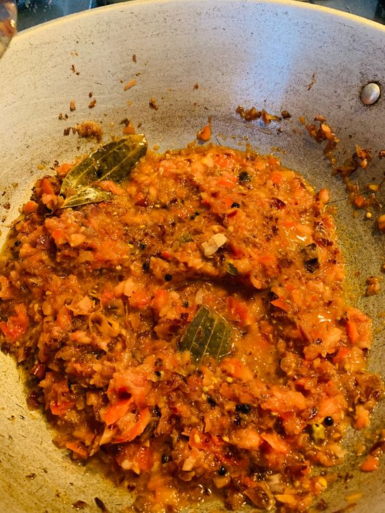 Step 2.1: Stir in tomatoes, cooking until they soften and become mushy
