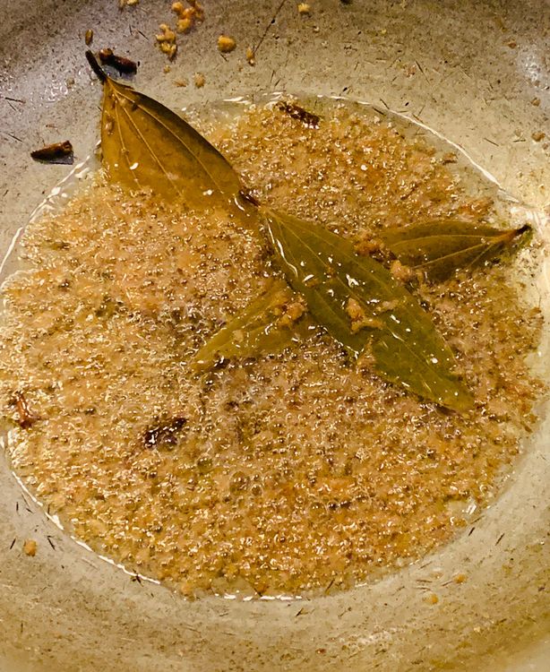 Step 2.1: In a heavy-bottomed deep pan or wok, heat oil on medium-high heat