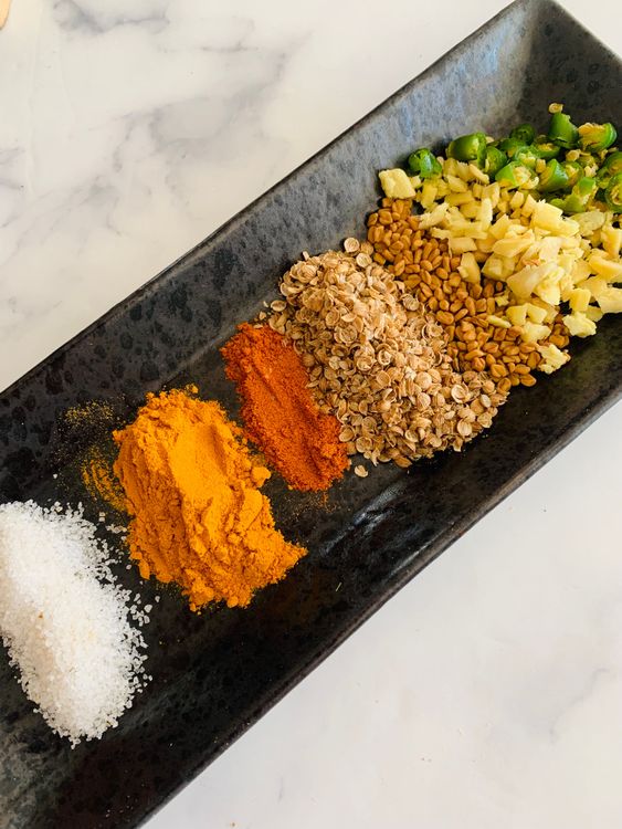 Step 1.1: Add salt, turmeric, red chilli powder, coriander powder, fenugreek seeds, ginger, and green chillies